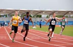433 Ben Shields (Rotherham Harriers)  wins the under-20 100 metres beating 445 Jordan Toth (Holmfirth), 359 Ricardo Brown (Leeds AC), Northern Championships, Sport City, Manchester